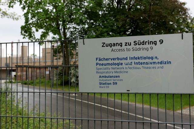 (FILES) A sign indicates the site of a department for infectious diseases and respiratory medicine at the Campus Virchow of the Charite hospital in Berlin on May 11, 2026. The German hospital on June 6, 2026 said it has discharged a US man who caught Ebola in the Democratic Republic of Congo, after 17 days of antiviral treatment and medical care cured him of the often deadly infection. The Charite public hospital in Berlin said the man -- who had been working as a surgeon for a Christian missionary group in the DRC -- and his five family members who had all been in quarantine were in "good health" and permitted to leave. (Photo by Odd ANDERSEN / AFP)