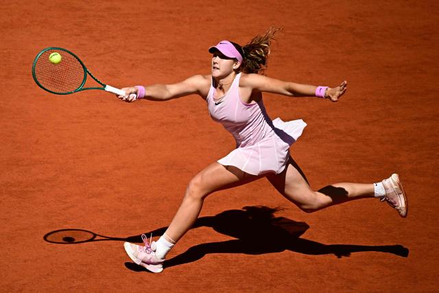 Russia's Mirra Andreeva plays a forehand return to Poland's Maja Chwalinska during their women's final singles match on day 14 of the French Open tennis tournament on Court Philippe-Chatrier at the Roland-Garros Complex in Paris on June 6, 2026. (Photo by JULIEN DE ROSA / AFP)