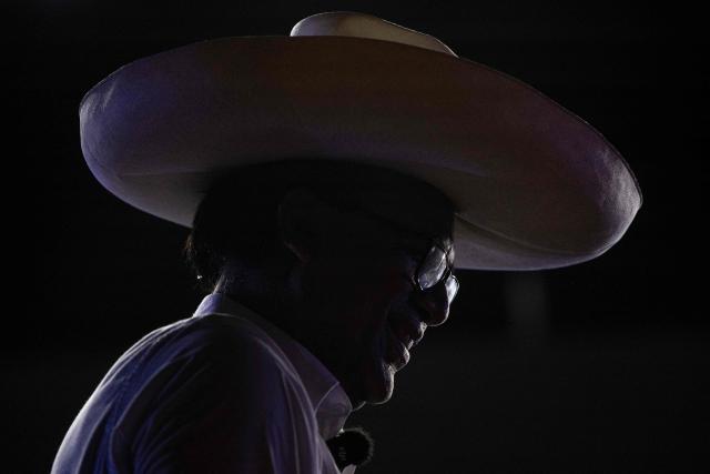 (FILES) Roberto Sanchez, Peru's presidential candidate for the Juntos por el Peru party, speaks to supporters during his closing campaign rally in Lima on June 4, 2026. A judge ruled on June 5, 2026 that Sanchez will stand trial for allegedly making false statements regarding his party's funding between 2018 and 2020. (Photo by Ernesto BENAVIDES / AFP)