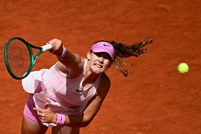 Russia's Mirra Andreeva serves to Poland's Maja Chwalinska during their women's final singles match on day 14 of the French Open tennis tournament on Court Philippe-Chatrier at the Roland-Garros Complex in Paris on June 6, 2026. (Photo by JULIEN DE ROSA / AFP)