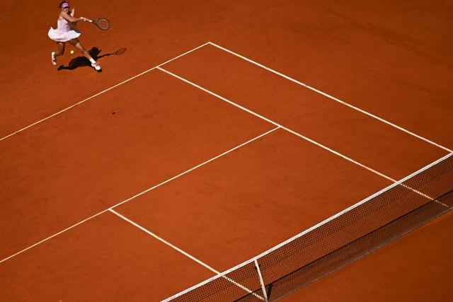 Russia's Mirra Andreeva plays a forehand return to Poland's Maja Chwalinska during their women's final singles match on day 14 of the French Open tennis tournament on Court Philippe-Chatrier at the Roland-Garros Complex in Paris on June 6, 2026. (Photo by JULIEN DE ROSA / AFP)