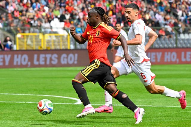 Belgium's forward #11 Jeremy Doku (L) fights for the ball with Tunisia's defender #05 Adem Arous during the international friendly football match between Belgium and Tunisia at the King Baudouin Stadium in Brussels on June 6, 2026. (Photo by JOHN THYS / AFP)