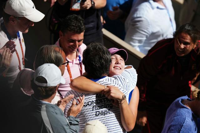 Russia's Mirra Andreeva celebrates with Spanish former tennis player and coach Conchita Martinez after winning her women's final singles match against Poland's Maja Chwalinska on day 14 of the French Open tennis tournament on Court Philippe-Chatrier at the Roland-Garros Complex in Paris on June 6, 2026. (Photo by Dimitar DILKOFF / AFP)