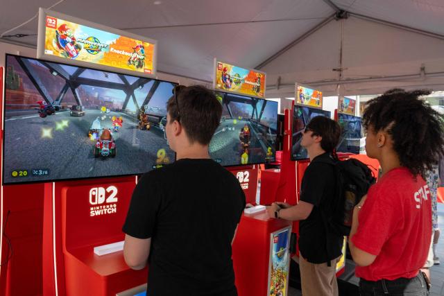 (FILES) People play Mario Kart World during a launch event ahead of the midnight release of the Nintendo Switch 2 at the Nintendo New York store on June 4, 2025. Video games are having a moment in the United States -- but the players are getting older.
The average American video game player is now 37 years old -- up from 29 about two decades ago -- as the industry reports activity climbing back to their highest levels since the pandemic-era boom, a new report reveals. (Photo by David Dee Delgado / AFP)