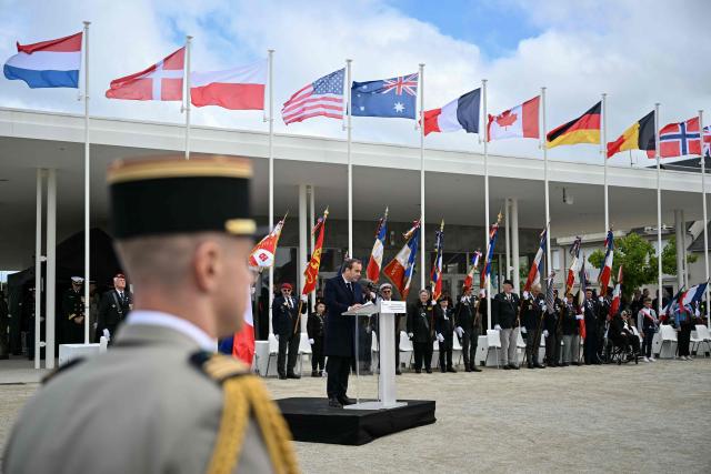 France's Prime Minister Sebastien Lecornu delivers a speech during an International commemorative ceremony for the 82nd anniversary of the World War II "D-Day" Normandy landings in Langrune-sur-Mer, northwestern France, of June 6, 2026. (Photo by LOU BENOIST / AFP)