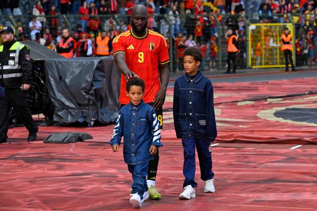 Belgium's forward #9 Romelu Lukaku walks around the stadium with his children after the international friendly football match between Belgium and Tunisia at the King Baudouin Stadium in Brussels on June 6, 2026. (Photo by JOHN THYS / AFP)