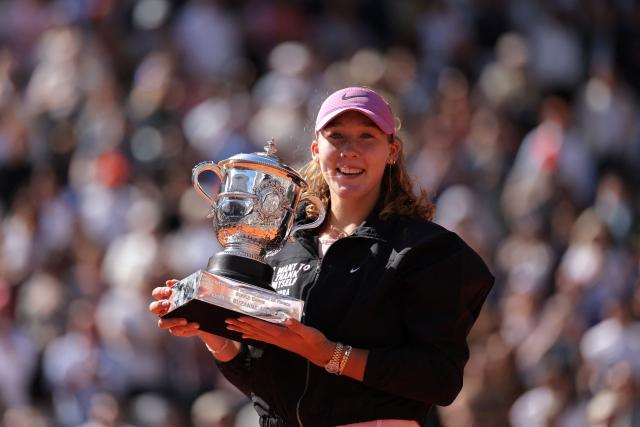 Russia's Mirra Andreeva holds the trophy after winning the French Open tennis tournament women's singles final match against Poland's Maja Chwalinska on day 14 of the French Open tennis tournament on Court Philippe-Chatrier at the Roland-Garros Complex in Paris on June 6, 2026. (Photo by Thomas SAMSON / AFP)