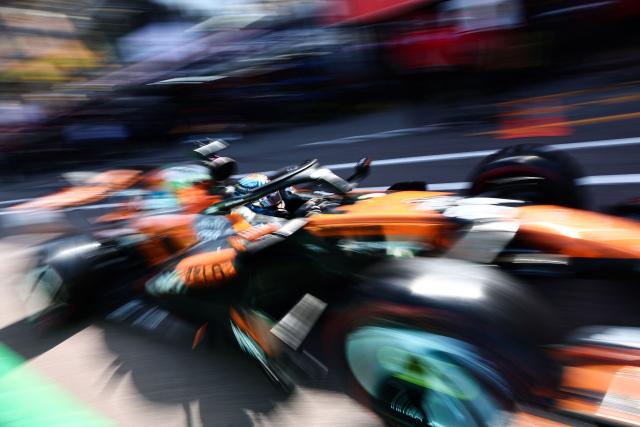 McLaren's Australian driver Oscar Piastri leaves the garage to compete in the qualifying session at the Monaco street circuit in Monaco, ahead of the Monaco Formula 1 Grand Prix, on June 6, 2026. (Photo by Jakub Porzycki / POOL / AFP)