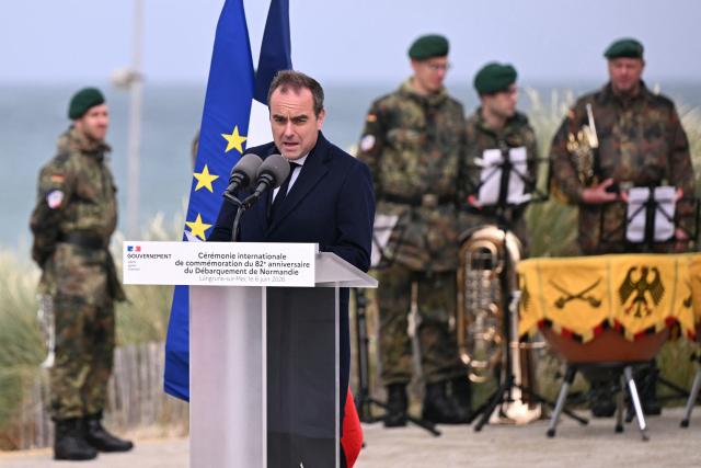 France's Prime Minister Sebastien Lecornu delivers a speech during an International commemorative ceremony for the 82nd anniversary of the World War II "D-Day" Normandy landings in Langrune-sur-Mer, northwestern France, of June 6, 2026. (Photo by LOU BENOIST / AFP)