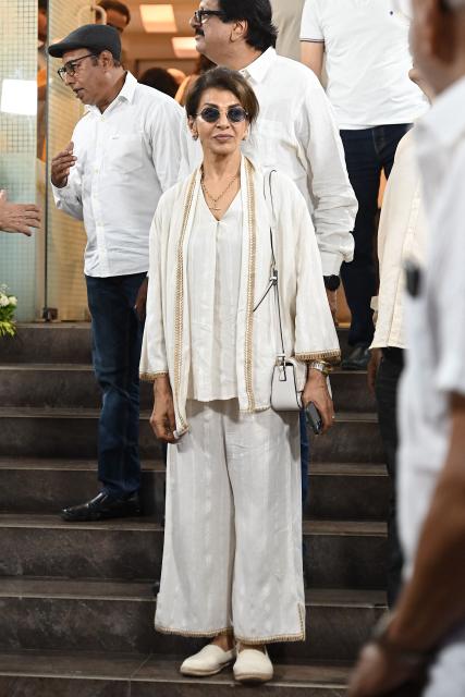Bollywood actress Anita Raj leaves after offering funeral prayers for film producer Pahlaj Nihalani in Mumbai on June 6, 2026. (Photo by SUJIT JAISWAL / AFP)