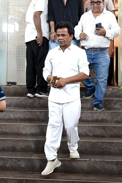 Bollywood actor Rajpal Yadav leaves after offering funeral prayers for film producer Pahlaj Nihalani in Mumbai on June 6, 2026. (Photo by SUJIT JAISWAL / AFP)