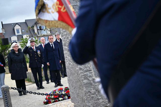 (From L) France's Defence Minister Catherine Vautrin, General Chief of Staff of the French Armed Forces Fabien Mandon, Britain's Defence Secretary John Healey  and France's Prime Minister Sebastien Lecornu attend an International commemorative ceremony for the 82nd anniversary of the World War II "D-Day" Normandy landings in Langrune-sur-Mer, northwestern France, of June 6, 2026. (Photo by LOU BENOIST / AFP)