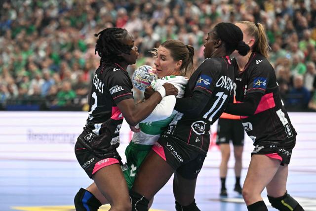 Gyori's Swedish line player Anna Lagerquist (2nd L), Brest Bretagne's French centre back Meline Nocandy (L) and Brest Bretagne's French line player Onacia Ondono (2nd R) vie for the ball during the EHF Women's Handball Champions League semi-final match between Brest Bretagne Handball and Gyori Audi ETO KC in Budapest on June 6, 2026. (Photo by Attila KISBENEDEK / AFP)
