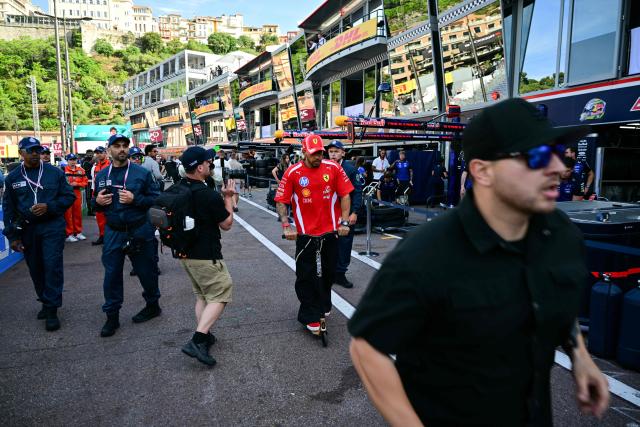 Ferrari's British driver Lewis Hamilton leaves the paddock on a scooter after competing in the qualifying session at the Monaco street circuit in Monaco, ahead of the Monaco Formula 1 Grand Prix, on June 6, 2026. (Photo by Andrej ISAKOVIC / AFP)