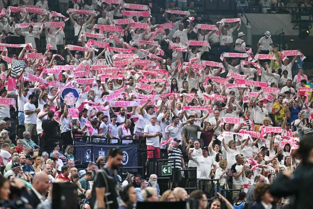 Brest fans cheer for their team during the EHF Women's Handball Champions League semi-final match between Brest Bretagne Handball and Gyori Audi ETO KC in Budapest on June 6, 2026. (Photo by Attila KISBENEDEK / AFP)