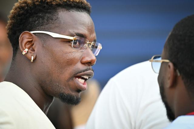 French football player Paul Pogba reacts in the paddock after attending the qualifying session at the Monaco street circuit in Monaco, ahead of the Monaco Formula 1 Grand Prix, on June 6, 2026. (Photo by Andrej ISAKOVIC / AFP)