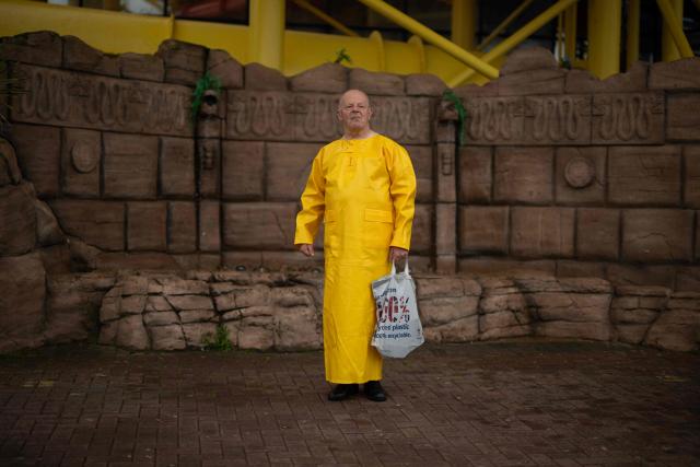 A man attends the start of the Pride parade on the Promenade in Blackpool, north west England on June 6, 2026. (Photo by Oli SCARFF / AFP)