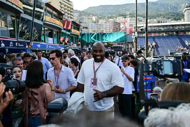 French judoka Teddy Riner react in the paddock after attending the qualifying session at the Monaco street circuit in Monaco, ahead of the Monaco Formula 1 Grand Prix, on June 6, 2026. (Photo by Andrej ISAKOVIC / AFP)