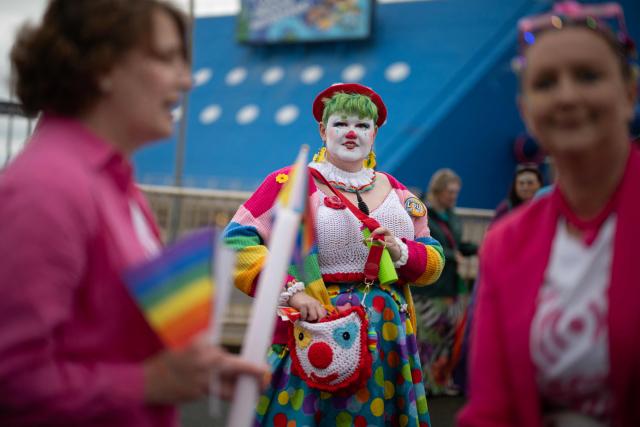 People arrive to attend the Pride parade on the Promenade in Blackpool, north west England on June 6, 2026. (Photo by Oli SCARFF / AFP)