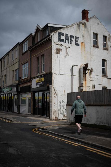 A man walks along a backstreet adjacent to the Promenade in Blackpool, north west England on June 6, 2026. (Photo by Oli SCARFF / AFP)