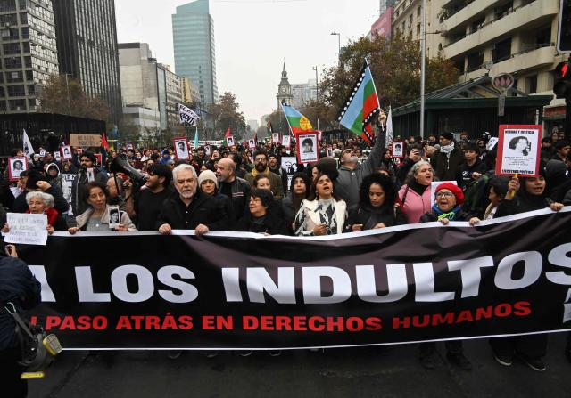 Demonstrators march against the human rights policies of Chile's President Jose Antonio Kast's government in Santiago on June 6, 2026. (Photo by RODRIGO ARANGUA / AFP)