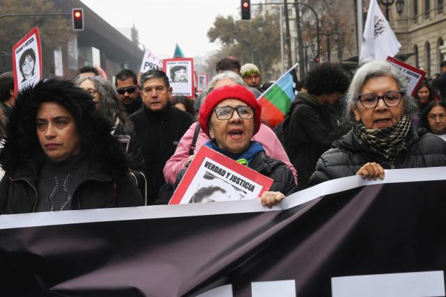Demonstrators march against the human rights policies of Chile's President Jose Antonio Kast's government in Santiago on June 6, 2026. (Photo by RODRIGO ARANGUA / AFP)