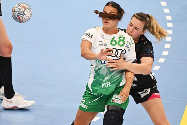 Brest Bretagne's French back Clarisse Mairot (R) and Gyori's Danish centre back Helena Elver Hageso (2nd R) vie for the ball during the EHF Women's Handball Champions League semi-final match between Brest Bretagne Handball and Gyori Audi ETO KC in Budapest on June 6, 2026. (Photo by Attila KISBENEDEK / AFP)