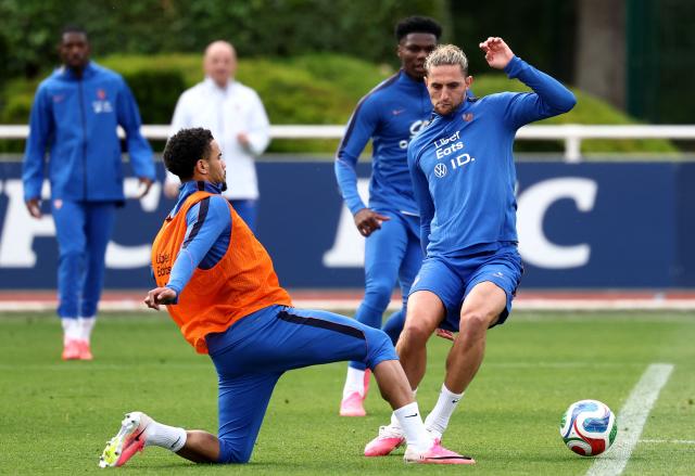 14France's midfielder #14 Adrien Rabiot (R) fights for the ball with France's midfielder #18 Warren Zaire Emery during a training session at the French Football Federation's (FFF) training ground in Clairefontaine-en-Yvelines, southwest of Paris on June 6, 2026, as part of the team's preparation for upcoming 2026 FIFA World Cup football tournament. (Photo by FRANCK FIFE / AFP)