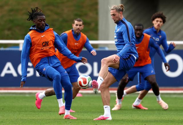 France's midfielder #14 Adrien Rabiot (R) fights for the ball with France's midfielder #06 Manu Kone during a training session at the French Football Federation's (FFF) training ground in Clairefontaine-en-Yvelines, southwest of Paris on June 6, 2026, as part of the team's preparation for upcoming 2026 FIFA World Cup football tournament. (Photo by FRANCK FIFE / AFP)