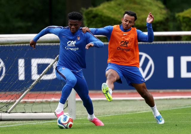 Fance's midfielder #08 Aurelien Tchouameni (L) fights for the ball with France's defender #05 Jules Kounde during a training session at the French Football Federation's (FFF) training ground in Clairefontaine-en-Yvelines, southwest of Paris on June 6, 2026, as part of the team's preparation for upcoming 2026 FIFA World Cup football tournament. (Photo by FRANCK FIFE / AFP)
