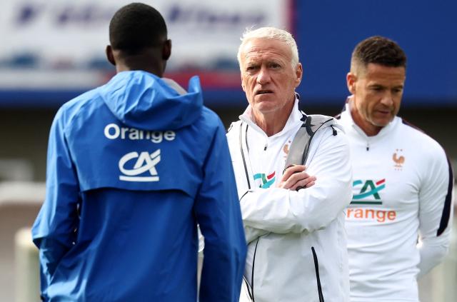 France's head coach Didier Deschamps (C) speaks with France's forward #07 Ousmane Dembele (L) during a training session at the French Football Federation's (FFF) training ground in Clairefontaine-en-Yvelines, southwest of Paris on June 6, 2026, as part of the team's preparation for upcoming 2026 FIFA World Cup football tournament. (Photo by FRANCK FIFE / AFP)