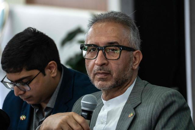 Iran's ambassador to Mexico Abolfazl Pasandideh (R) gestures during a press conference ahead of the arrival of the national football team for the FIFA 2026 World Cup football tournament, in Tijuana, Baja California, Mexico on June 6, 2026, Iran lashed out at the United States for refusing visas to some of its squad support staff as the players were to leave Turkey for Mexico, just days before the June 11 start of the 2026 World Cup, which is being jointly hosted by the United States, Mexico and Canada. (Photo by Chris Noyola / AFP)