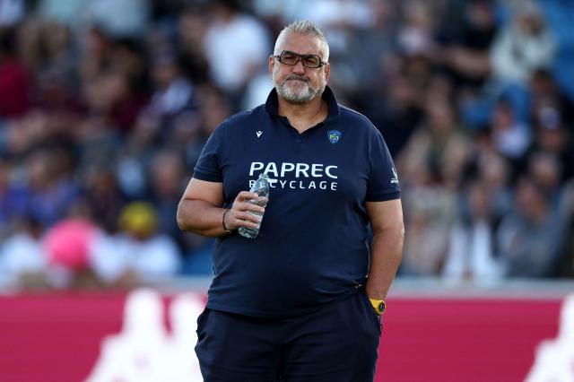 Clermont's French head coach Christophe Urios looks on during the warm up ahead of the French Top14 rugby union match between Union Bordeaux-Begles (UBB) and ASM Clermont Auvergne at the Chaban-Delmas Stadium in Bordeaux, south-western France on June 6, 2026. (Photo by ROMAIN PERROCHEAU / AFP)