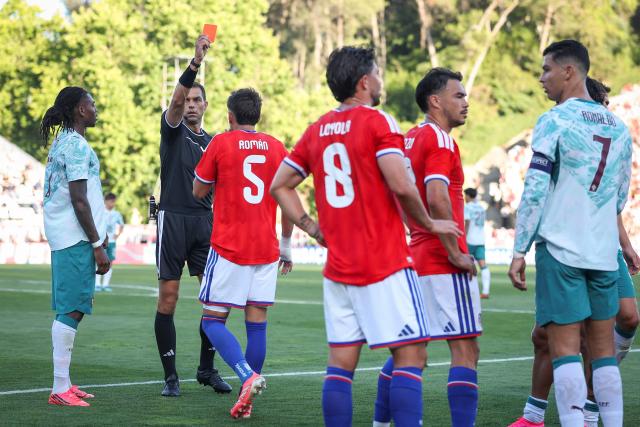 Chile’s defender #5 Ivan Roman takes the red card during the international friendly football match between Portugal and Chile at Estadio Nacional do Jamor in Oeiras, on June 6, 2026. (Photo by PATRICIA DE MELO MOREIRA / AFP)