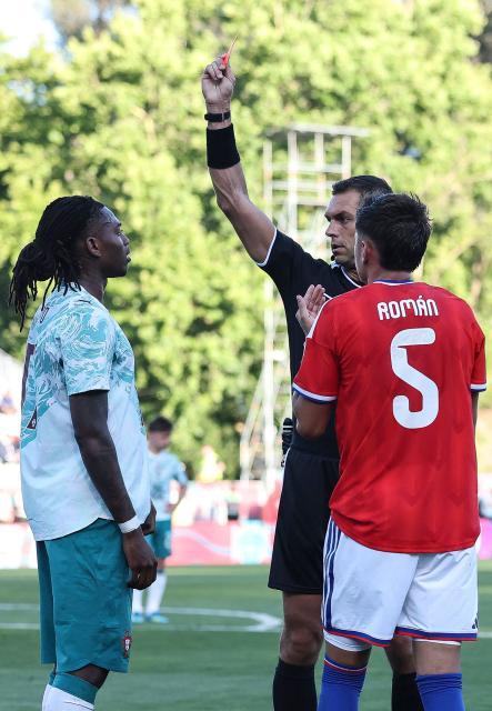 Portugal’s forward #17 Rafael Leao (L) takes the red card during the international friendly football match between Portugal and Chile at Estadio Nacional do Jamor in Oeiras, on June 6, 2026. (Photo by PATRICIA DE MELO MOREIRA / AFP)