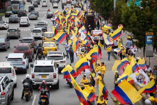 Supporters of Colombia's presidential candidate Abelardo de la Espriella, from the Defensores de la Patria political movement, gather waving Colombian flags during a "Banderazo" in Bogota on June 6, 2026. Colombia will hold the runoff presidential election on June 21. (Photo by ESTEBAN VEGA LA-ROTTA / AFP)
