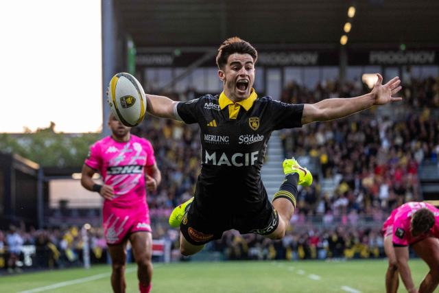 La Rochelle's French scrum-half Nolann Le Garrec dives to score the team's first try during the French Top14 rugby union match between Stade Rochelais (La Rochelle) and Stade Francais Paris at The Marcel-Deflandre Stadium in La Rochelle, western France on June 6, 2026. (Photo by XAVIER LEOTY / AFP)