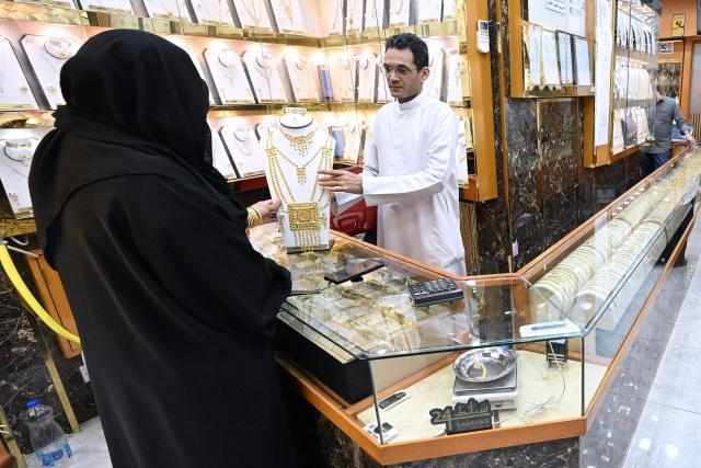 A Kuwaiti woman shops for gold jewellery in downtown Kuwait City on June 6, 2026. (Photo by YASSER AL-ZAYYAT / AFP)