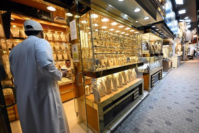 A Kuwaiti man shops for gold jewellery in downtown Kuwait City on June 6, 2026. (Photo by YASSER AL-ZAYYAT / AFP)