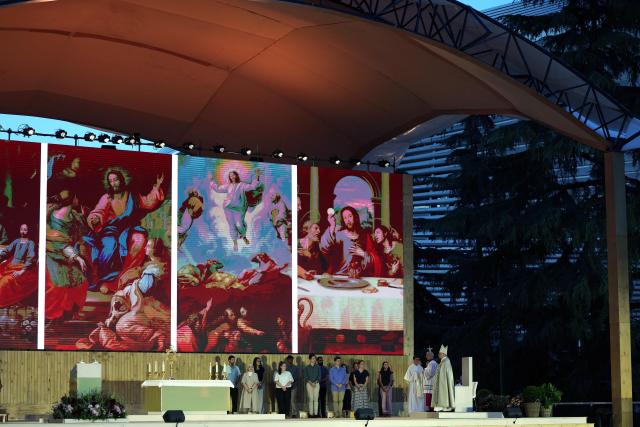 Pope Leo XIV holds a prayer vigil with young people in the Plaza de Lima in Madrid, with the Santiago Bernabeu stadium in the background, on June 6, 2026. Pope Leo XIV is visiting Spain June 6-12 with stops in Madrid, Barcelona, and the Canary Islands, where he will meet with migrants and organisations dedicated to helping them. (Photo by Thomas COEX / AFP)