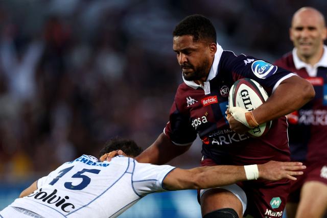 Bordeaux' French lock Boris Palu (R) is tackled as he runs with the ball during the French Top14 rugby union match between Union Bordeaux-Begles (UBB) and ASM Clermont Auvergne at the Chaban-Delmas Stadium in Bordeaux, south-western France on June 6, 2026. (Photo by ROMAIN PERROCHEAU / AFP)