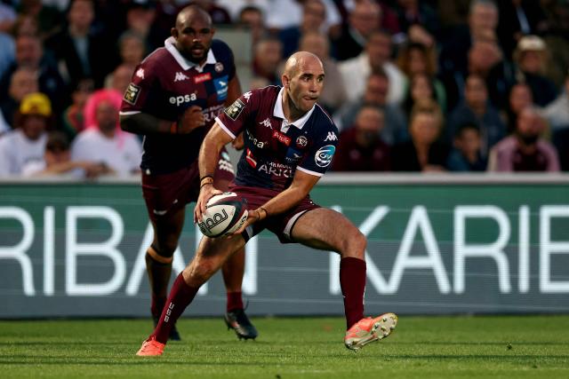Bordeaux' French scrum half Maxime Lucu runs with the ball during the French Top14 rugby union match between Union Bordeaux-Begles (UBB) and ASM Clermont Auvergne at the Chaban-Delmas Stadium in Bordeaux, south-western France on June 6, 2026. (Photo by ROMAIN PERROCHEAU / AFP)