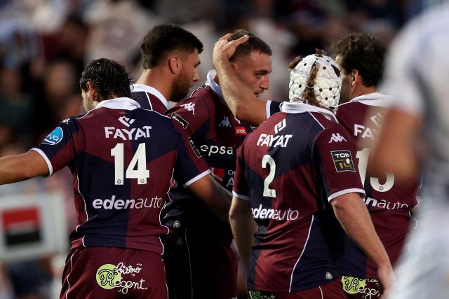 Bordeaux' French flanker Pierre Bochaton (C) celebrates with teammates after scoring a try during the French Top14 rugby union match between Union Bordeaux-Begles (UBB) and ASM Clermont Auvergne at the Chaban-Delmas Stadium in Bordeaux, south-western France on June 6, 2026. (Photo by ROMAIN PERROCHEAU / AFP)