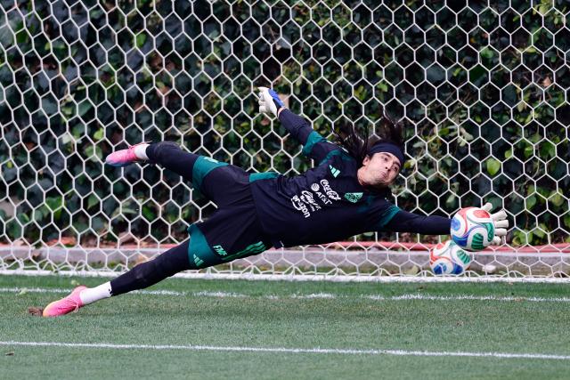Mexico's goalkeeper Carlos Acevedo dives for the ball during a training session ahead of the FIFA 2026 World Cup at Centro de Alto Rendimiento in Mexico City on June 6, 2026. (Photo by Rodrigo Oropeza / AFP)