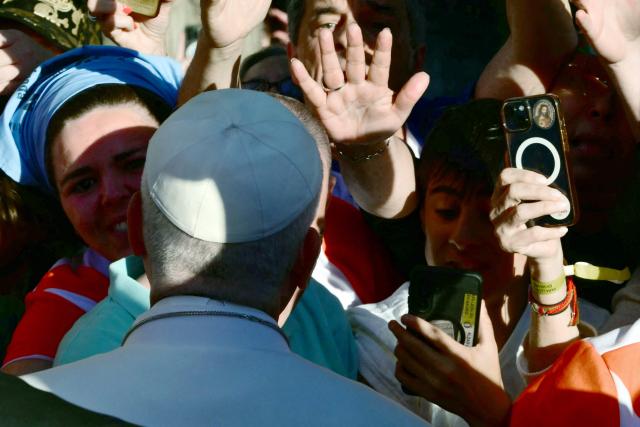 Pope Leo XIV approaches the faithful during a prayer vigil with young people in the Plaza de Lima in Madrid on June 6, 2026. Pope Leo XIV is visiting Spain June 6-12 with stops in Madrid, Barcelona, and the Canary Islands, where he will meet with migrants and organisations dedicated to helping them. (Photo by Stefano RELLANDINI / AFP)
