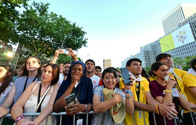 Believers attend a prayer vigil led by Pope Leo XIV in the Plaza de Lima in Madrid on June 6, 2026. Pope Leo XIV is visiting Spain June 6-12 with stops in Madrid, Barcelona, and the Canary Islands, where he will meet with migrants and organisations dedicated to helping them. (Photo by Stefano RELLANDINI / AFP)