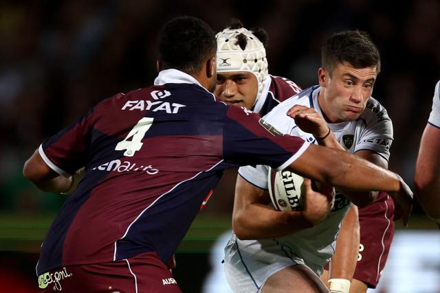 Clermont's Argentine winger Bautista Delguy (R) is tackled as he runs with the ball during the French Top14 rugby union match between Union Bordeaux-Begles (UBB) and ASM Clermont Auvergne at the Chaban-Delmas Stadium in Bordeaux, south-western France on June 6, 2026. (Photo by ROMAIN PERROCHEAU / AFP)