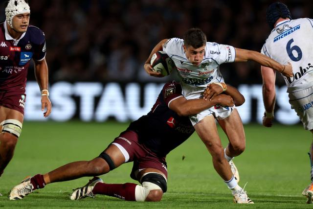 Clermont's Argentine winger Bautista Delguy (R) is tackled as he runs with the ball during the French Top14 rugby union match between Union Bordeaux-Begles (UBB) and ASM Clermont Auvergne at the Chaban-Delmas Stadium in Bordeaux, south-western France on June 6, 2026. (Photo by ROMAIN PERROCHEAU / AFP)