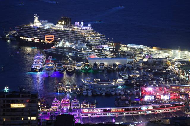 This photograph shows a general view of yachts docked at the Monte Carlo harbour in Monaco with the F1 pit lane and the Circuit de Monaco in the foreground in Monaco on June 6, 2026, ahead of the Formula One Monaco Grand Prix. (Photo by Valery HACHE / AFP)