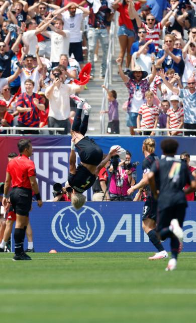 Antonee Robinson of the US celebrates scoring during the international friendly football match between USA and Germany at Soldier Field in Chicago, Illinois, on June 6, 2026. (Photo by KAMIL KRZACZYNSKI / AFP)